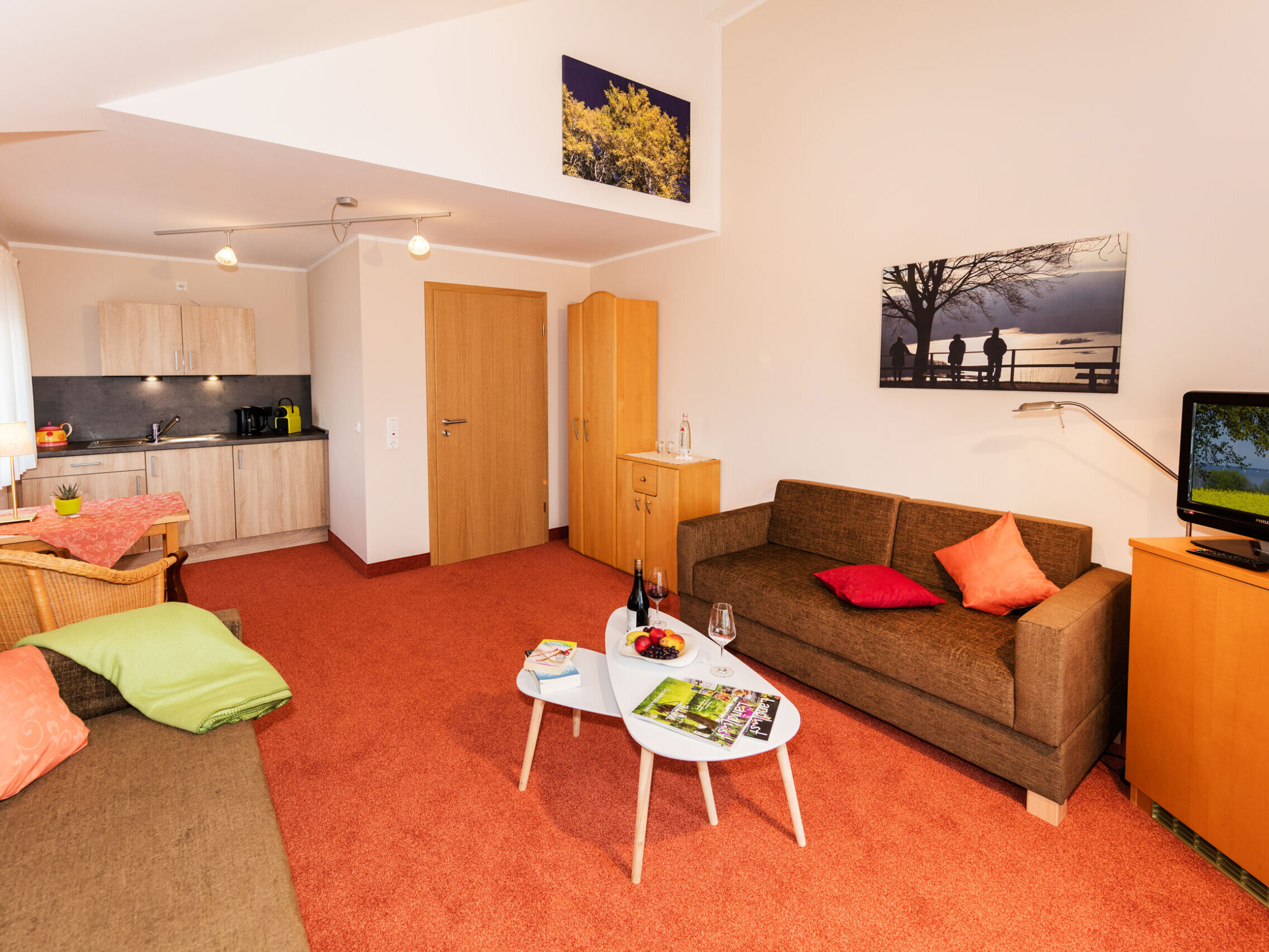 Apartment at Hotel Haus Seeblick in the Eifel with separate bedroom, balcony and living area.