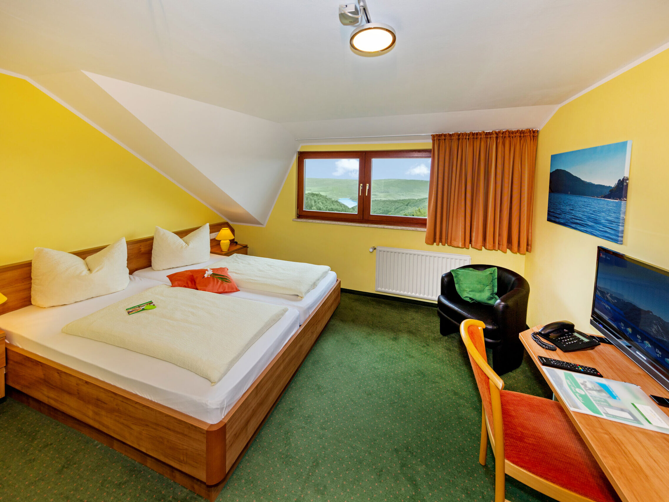 Comfort Plus Double Room at Hotel Haus Seeblick with balcony, lake view and modern bathroom.