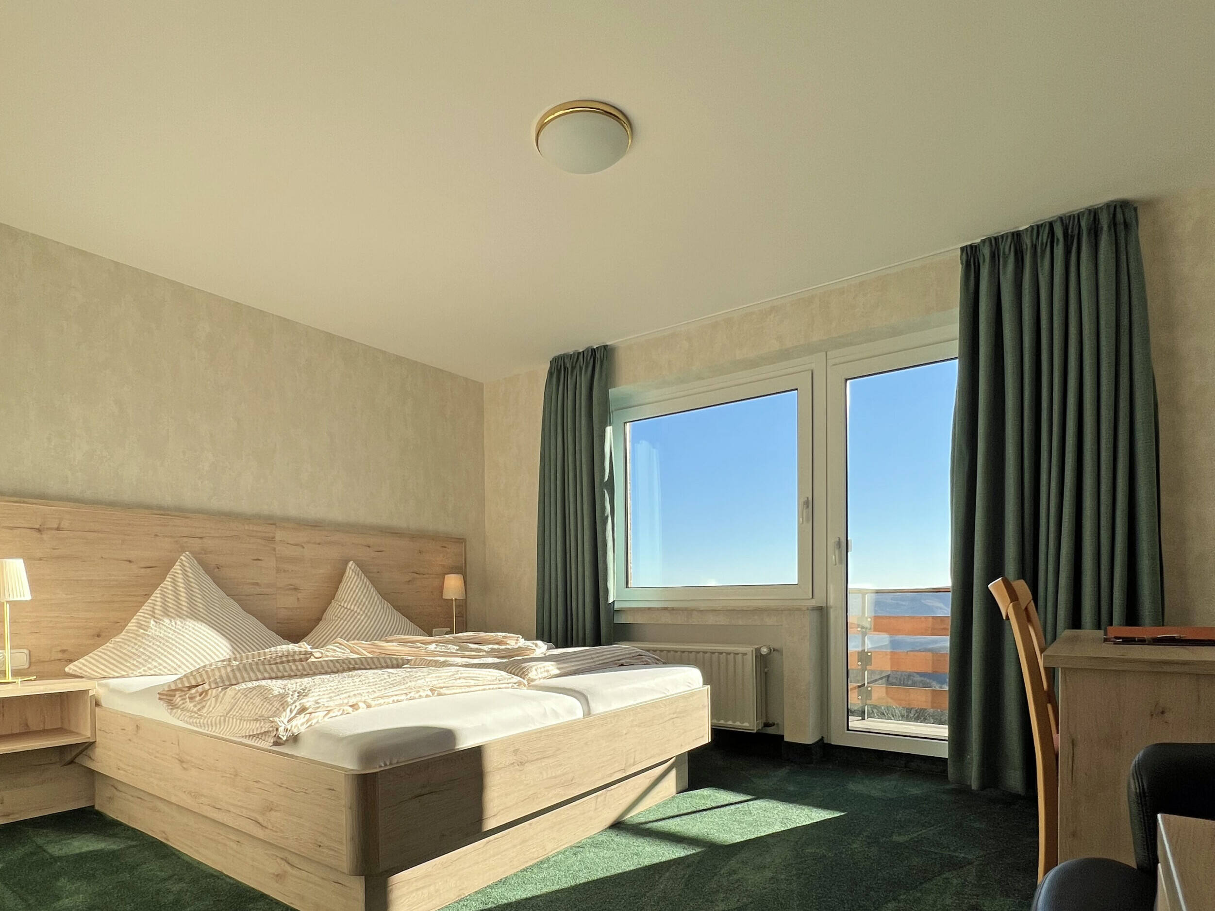 Comfort Plus Double Room at Hotel Haus Seeblick with balcony, lake view and modern bathroom.